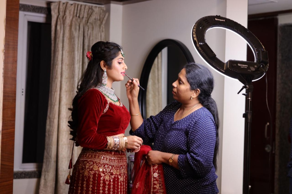 Jayakala — Kishaley Makeup Artist applying bridal makeup
