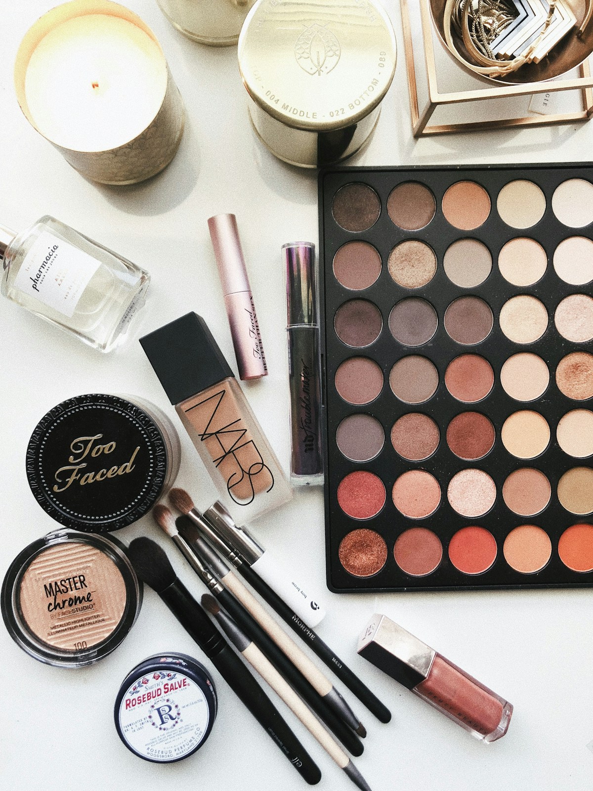 Makeup brushes and cosmetics arranged for beauty preparation